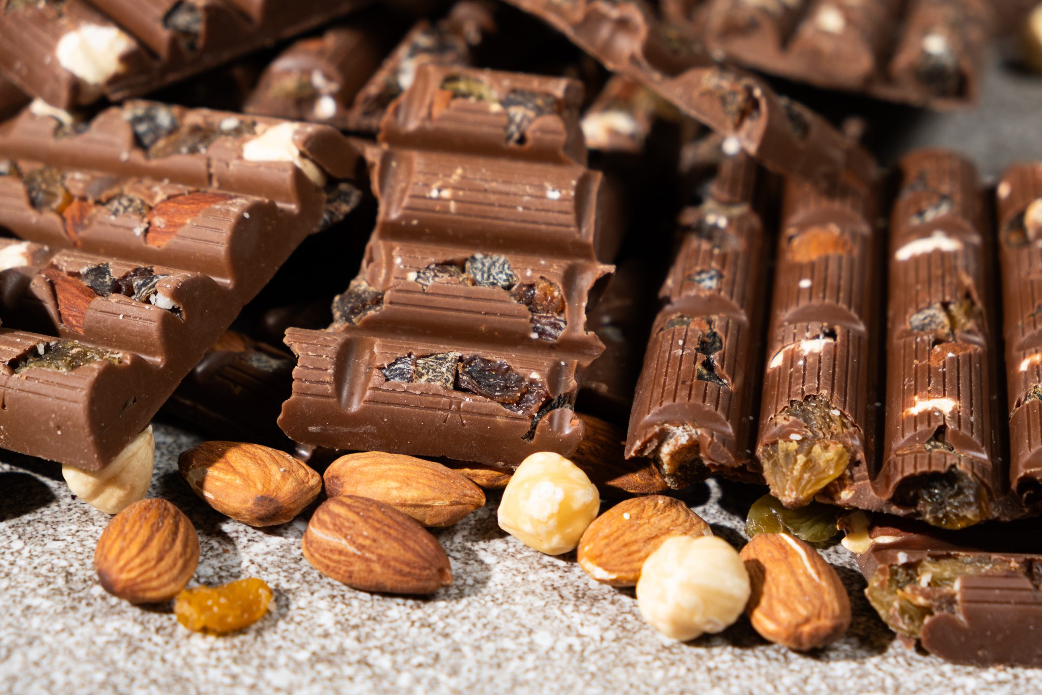 Chocolate bars with nuts and dried fruits.