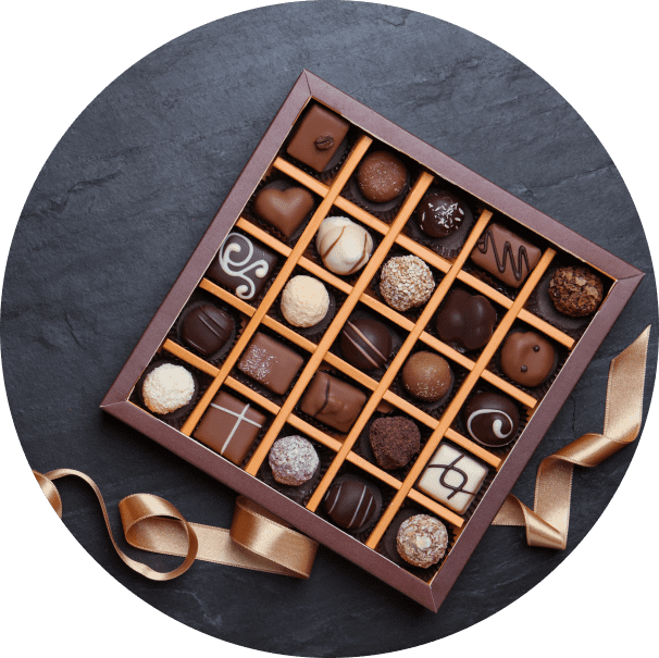 Group 1321317517 Box of assorted chocolates with ribbon.